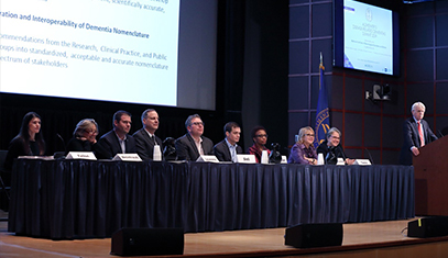 Members of DeNomI sit on a panel during a conference presentation