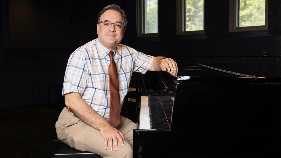 Borna Bonakdarpour sitting at a piano