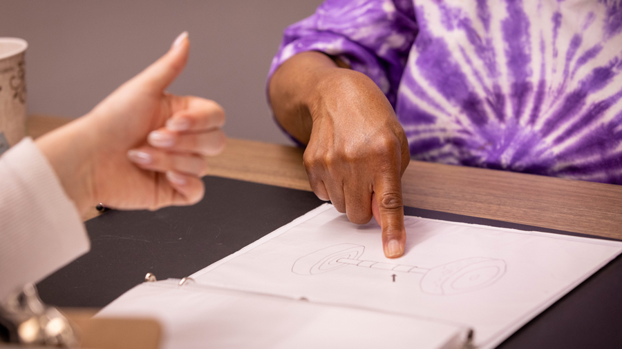 A participant completes a memory test during a recent visit. 